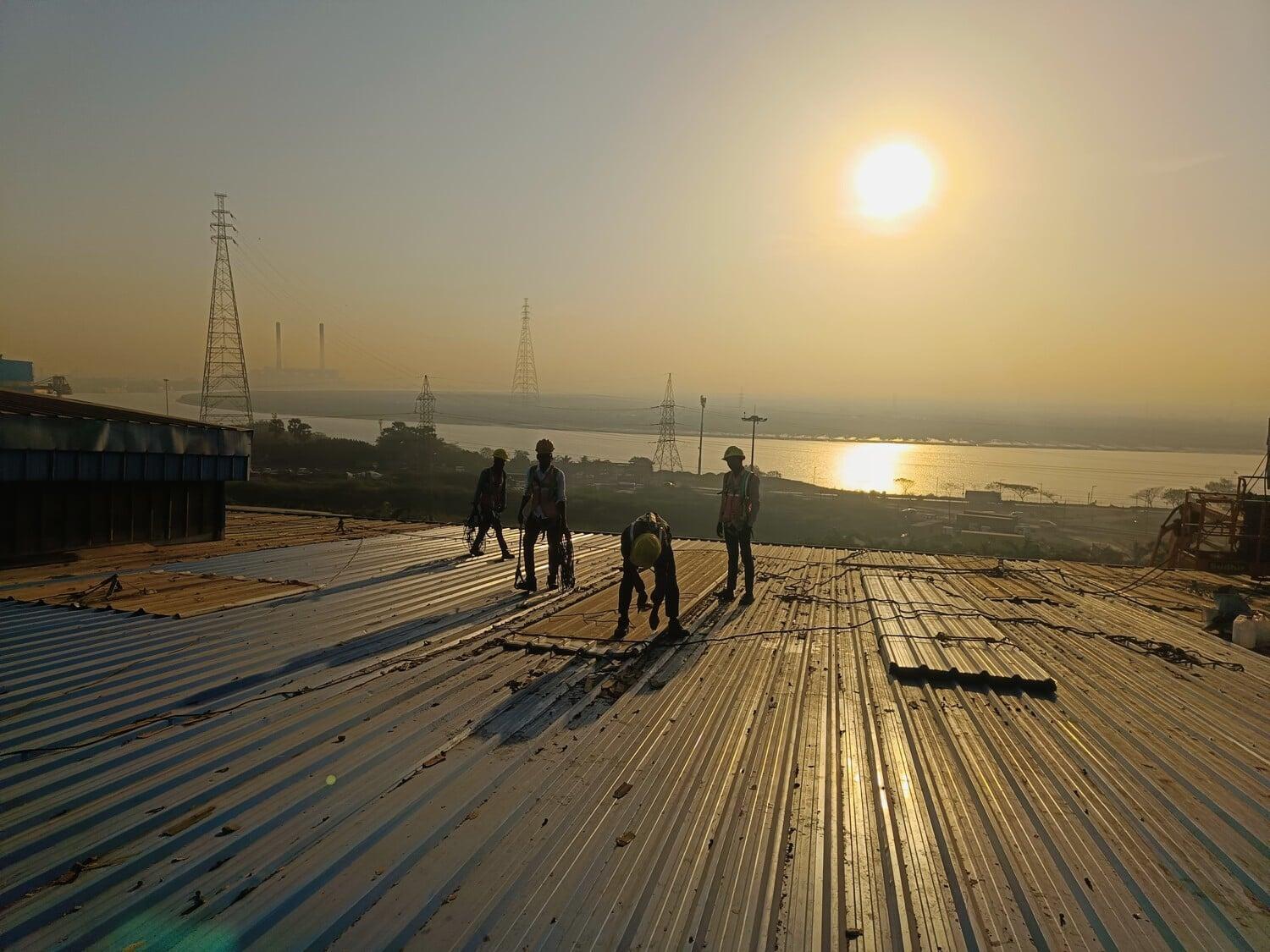 Commercial architectural roofing at Oberoi Mall, Mumbai: Specialized Kliplok roof-on-roof installation by Rishonn & Reyansh for leak-proof retail infrastructure.